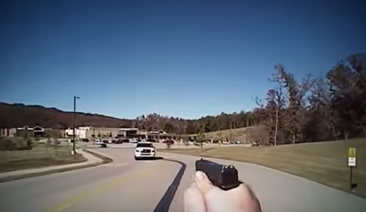 Cop shoots woman trying to run him over