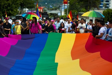 Gay rights activists participate in a demonstration marking the International Day Against Homophobia and Transphobia (IDAHOT) in San Salvador, on May 17, 2014. The 9th annual event, billed by organisers as the biggest LGBT solidarity event in the world, is aimed at raising awareness about discrimation and calling for equal rights. AFP PHOTO / Jose CABEZAS        (Photo credit should read JOSE CABEZAS/AFP/Getty Images)